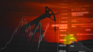 Pompe à pétrole avec graphique de marché financier, illustrant la hausse du WTI et ses risques pour l’inflation en Haïti.