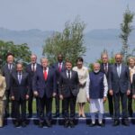 Dirigeants et invités internationaux posant lors du sommet du G7 2026 à Évian, en France.